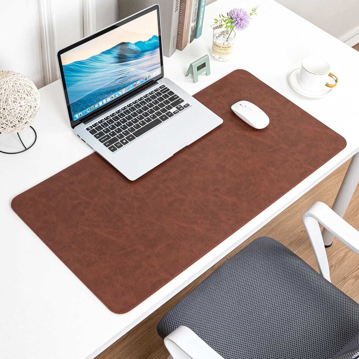 NOIRDEN large brown leather desk mat with laptop and mouse on a white desk, angled overhead view