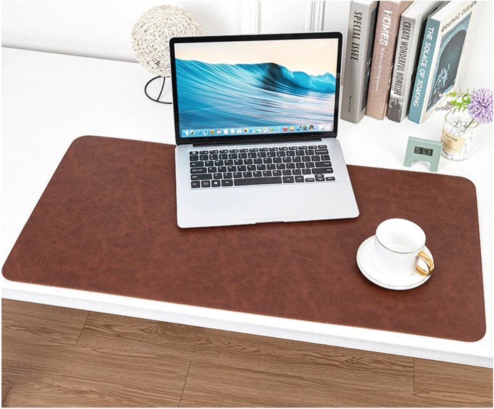 NOIRDEN premium leather desk mat styled on a modern home office desk with laptop and accessories